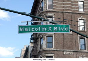 Street sign of the Malcolm X Blvd in East Harlem in New York City 